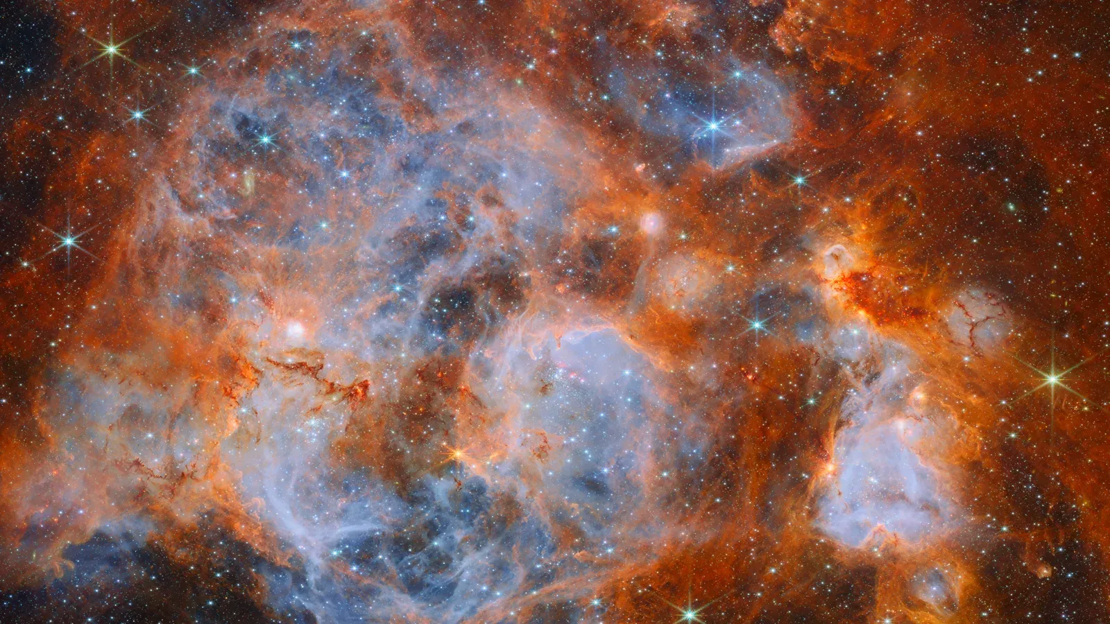 เนบิวลา N159 ในเมฆแมเจลแลนใหญ่ ภาพอินฟราเรดจากกล้อง NIRCam ของ James Webb