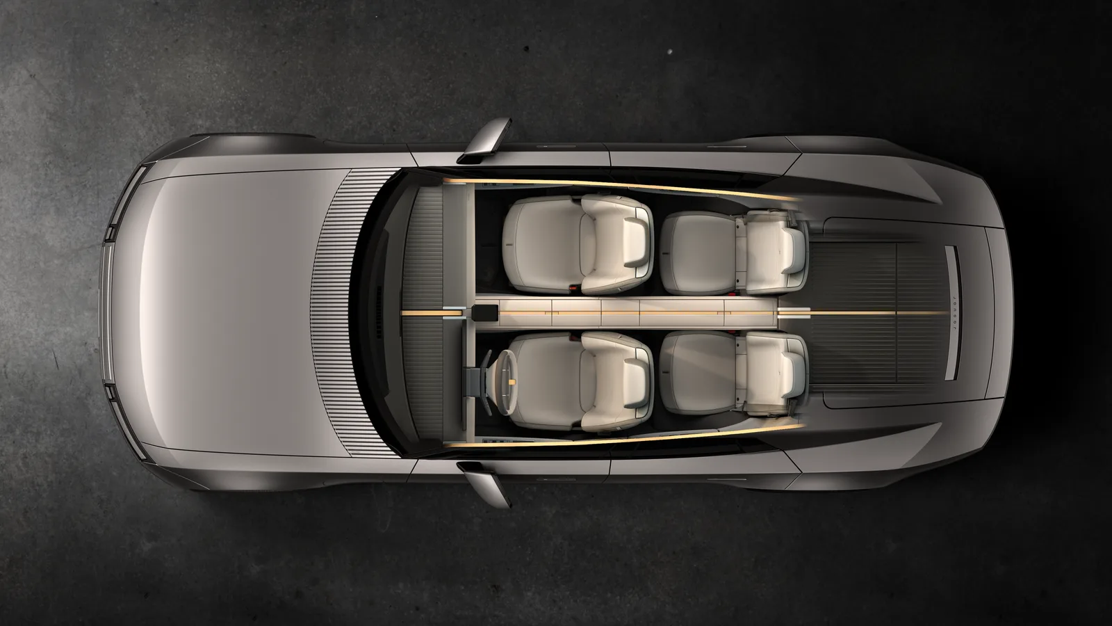 ภาพมุมบนแบบตัดหลังคาของ Jaguar Type 01 แสดงที่นั่งเดี่ยว 4 ตำแหน่งและแกนกลางยาวตลอดห้องโดยสาร