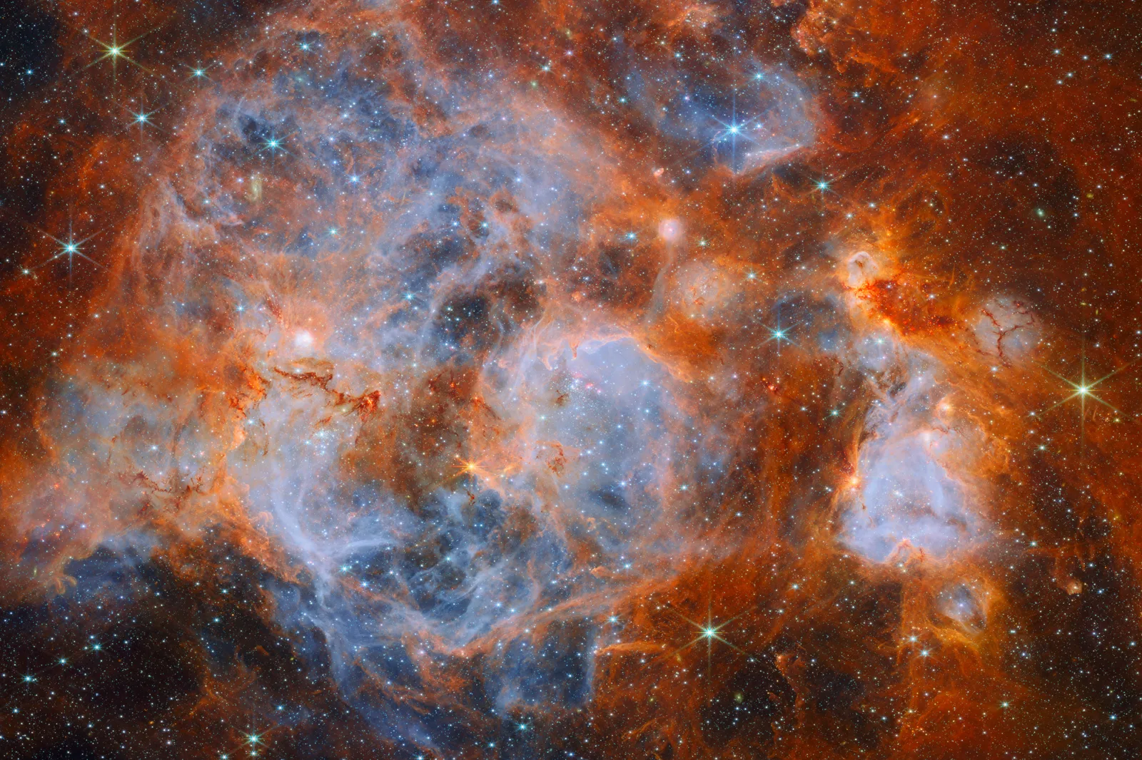 เนบิวลา N159 ในเมฆแมเจลแลนใหญ่ ภาพอินฟราเรดจากกล้อง NIRCam ของ James Webb